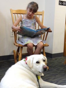 Bela reads the adventures of CatDog to Hayley.