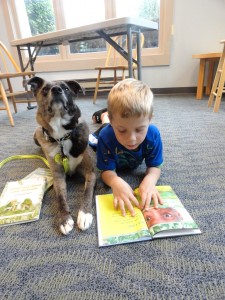 Jay and Fragg share a book at our Mentor-on-the-Lake Branch.
