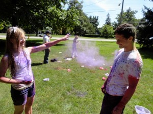 Teens throw colored dye at one another during our Holi celebration last summer.