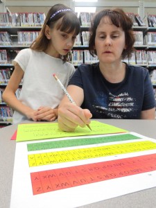 Peyton and her mom, Theresa, sort out some Poe codes during our cryptography program at Headlands.