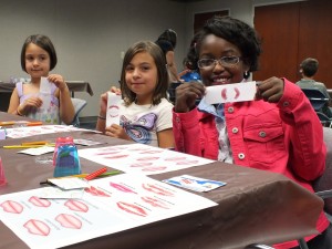 The kids learn how to identify different kinds of lip prints, just like they were fingerprints.