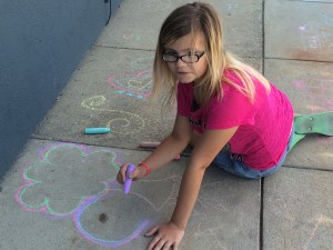 Getting creative with the chalk on the Headlands Branch sidewalk.
