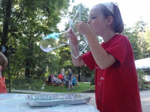 Libby Davis tries to blow the world's most stupendous bubble during our Summer Reading finale party.