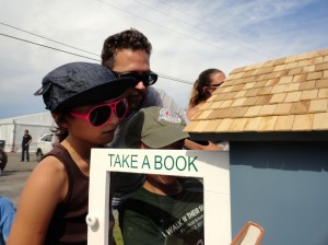 A family checks out the selection in our Little Free Library Saturday.