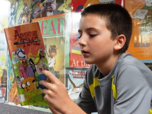 Nicholas checks out an issue of Adventure Time during our Comics Club.