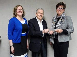 Mentor Public Library Executive Director Cheryl Kuonen (left) and Board of Trustees President Diane Wantz thank Charles N. Higgins Jr., the trustee of the
